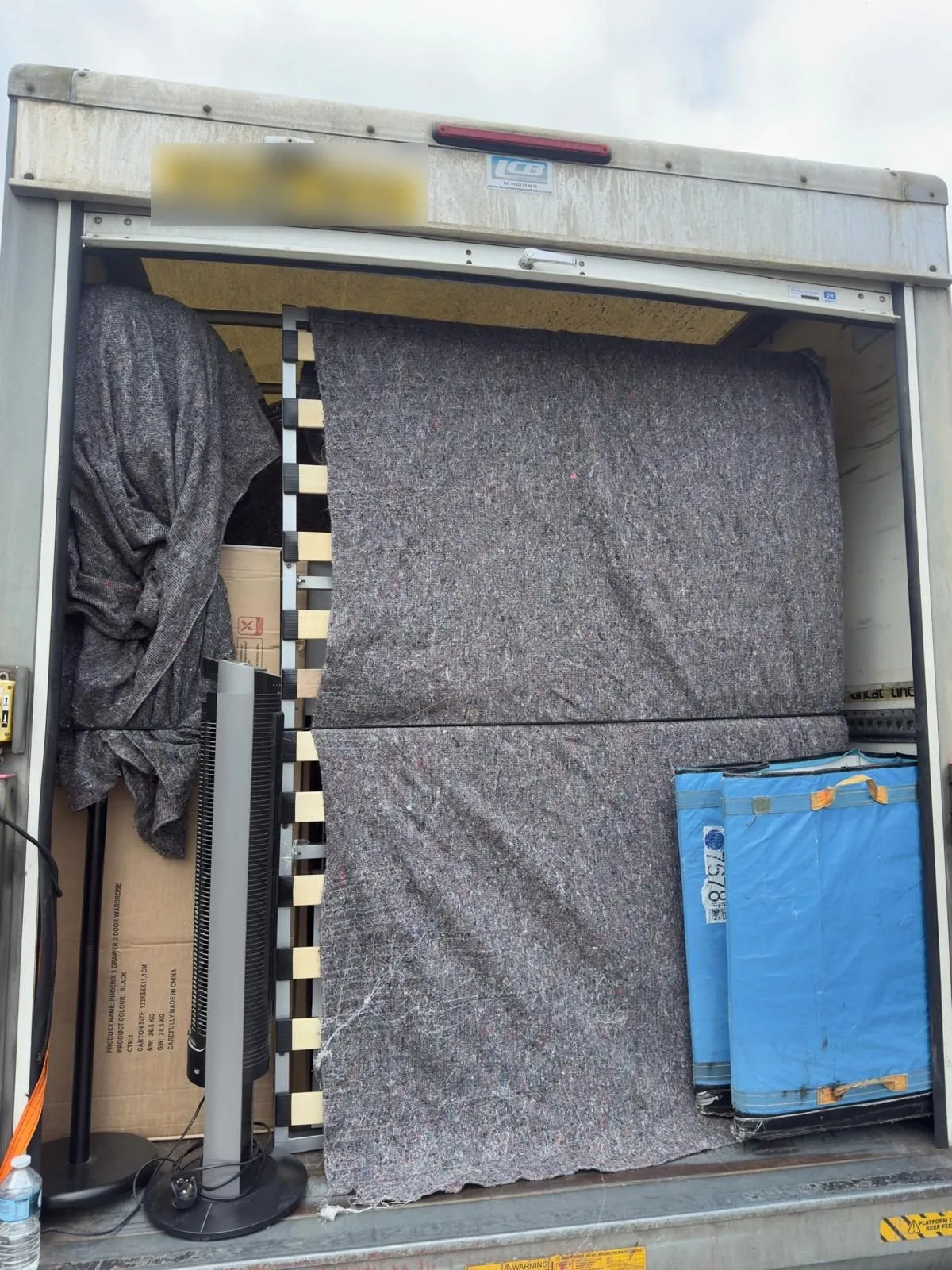 Removal van being loaded at a business premises, commercial removals in Bradford